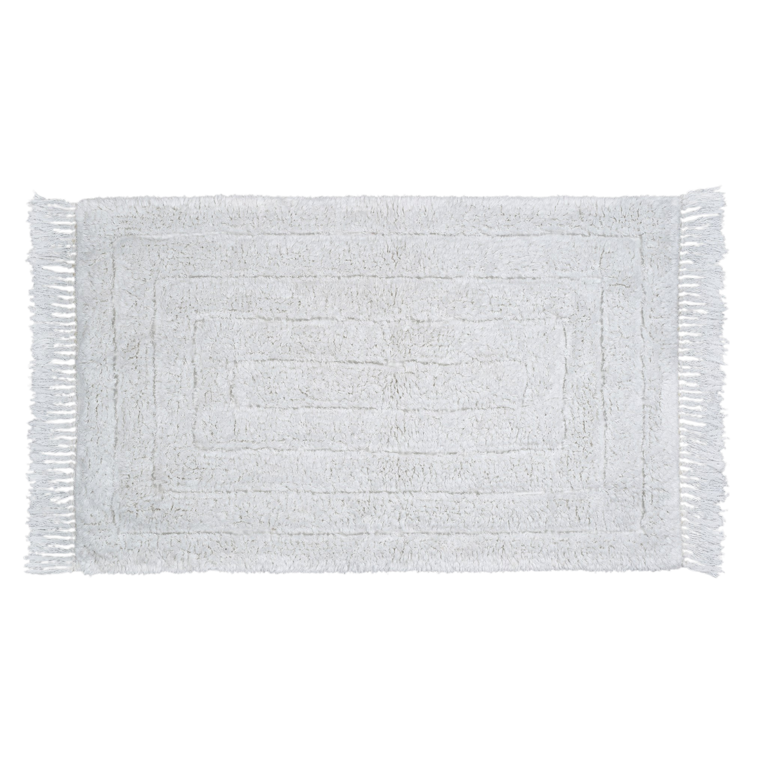 Tapis de bain rectangulaire tufté, teinte claire, bords à franges