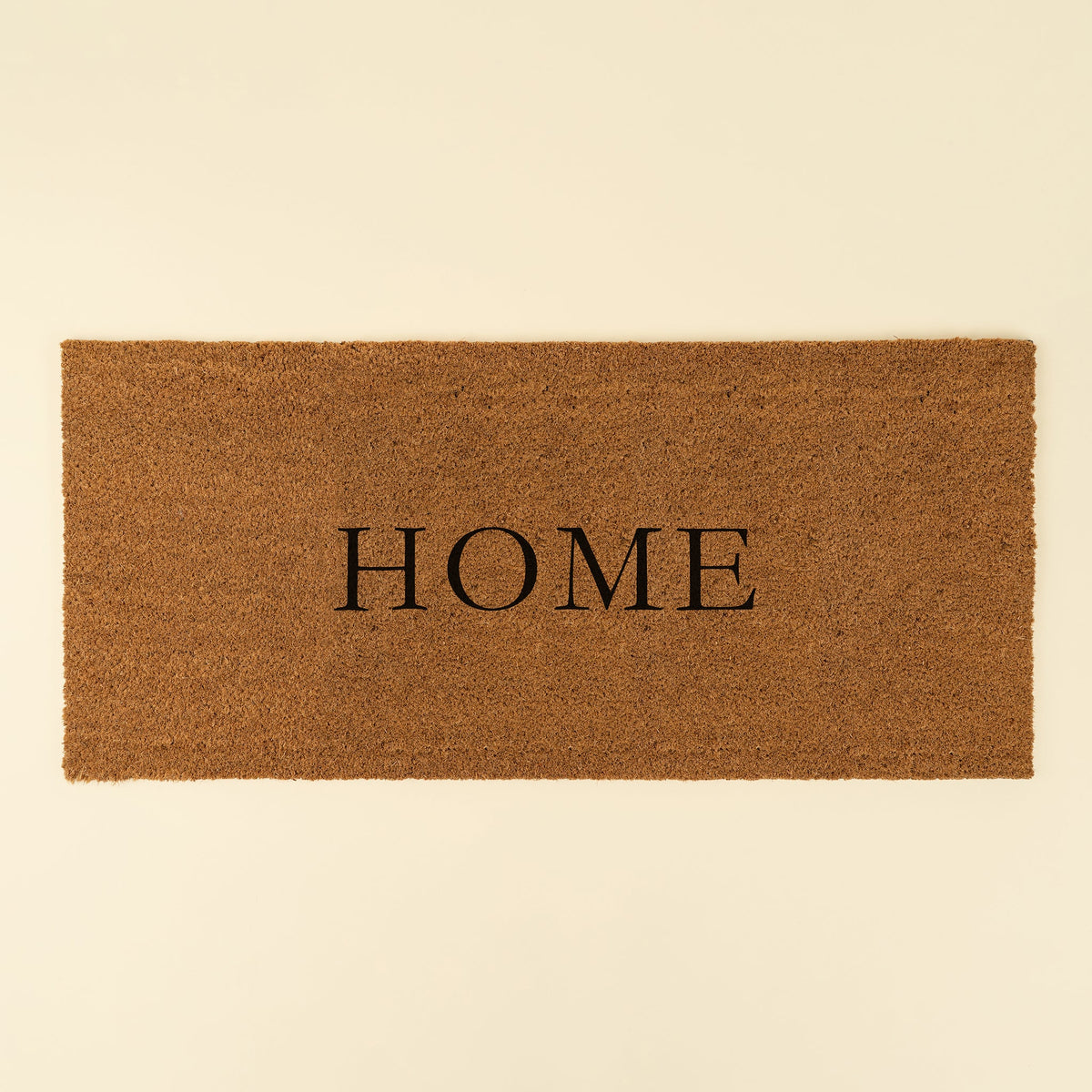 Paillasson d’entrée « Home » en fibre de coco naturelle avec endos en PVC, grand format.