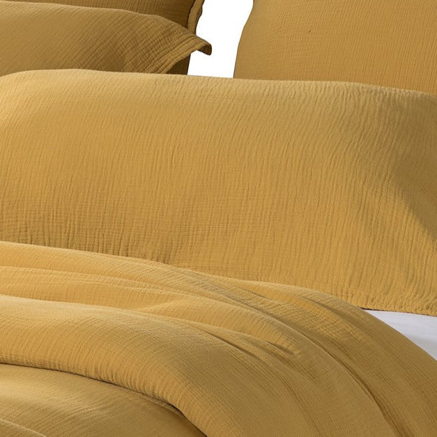 Housse de couette en mousseline jaune pour lit double-queen et king, avec fermeture éclair, sur fond blanc, plan rapproché