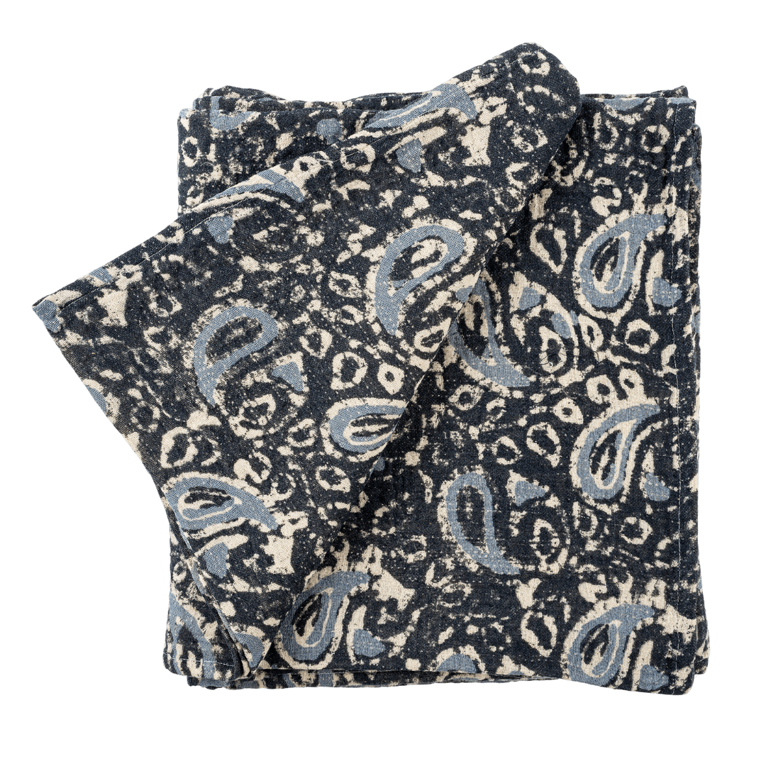 Nappe en coton à motifs botaniques bleus, tissu plissé plié