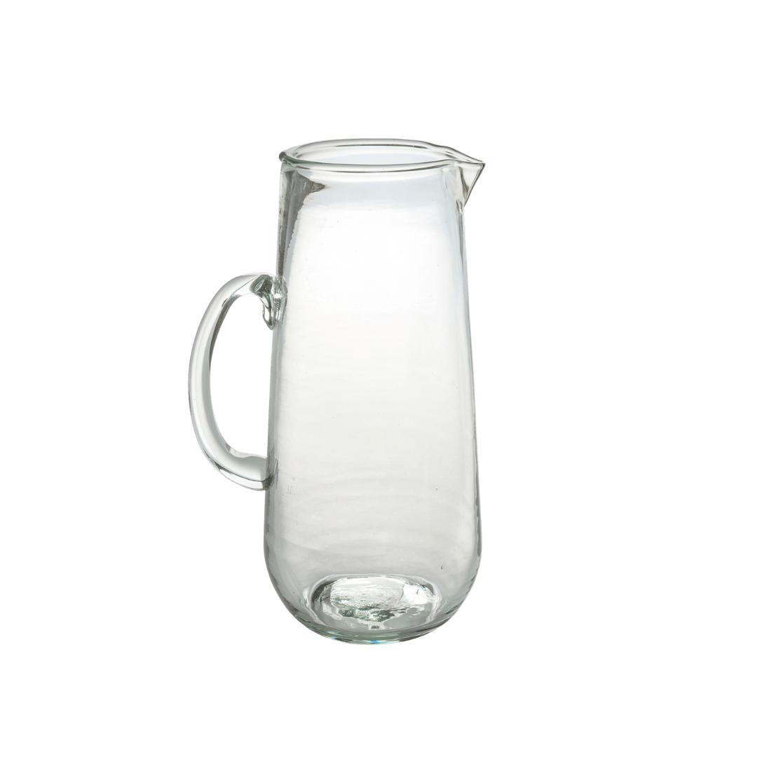 Pichet en verre soufflé transparent, petit format, poignée latérale.