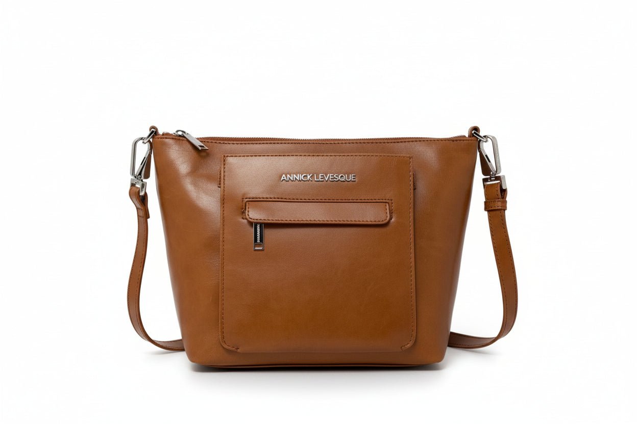 Sac à main en cuir cognac avec bandoulière réglable et fermeture zippée centrale