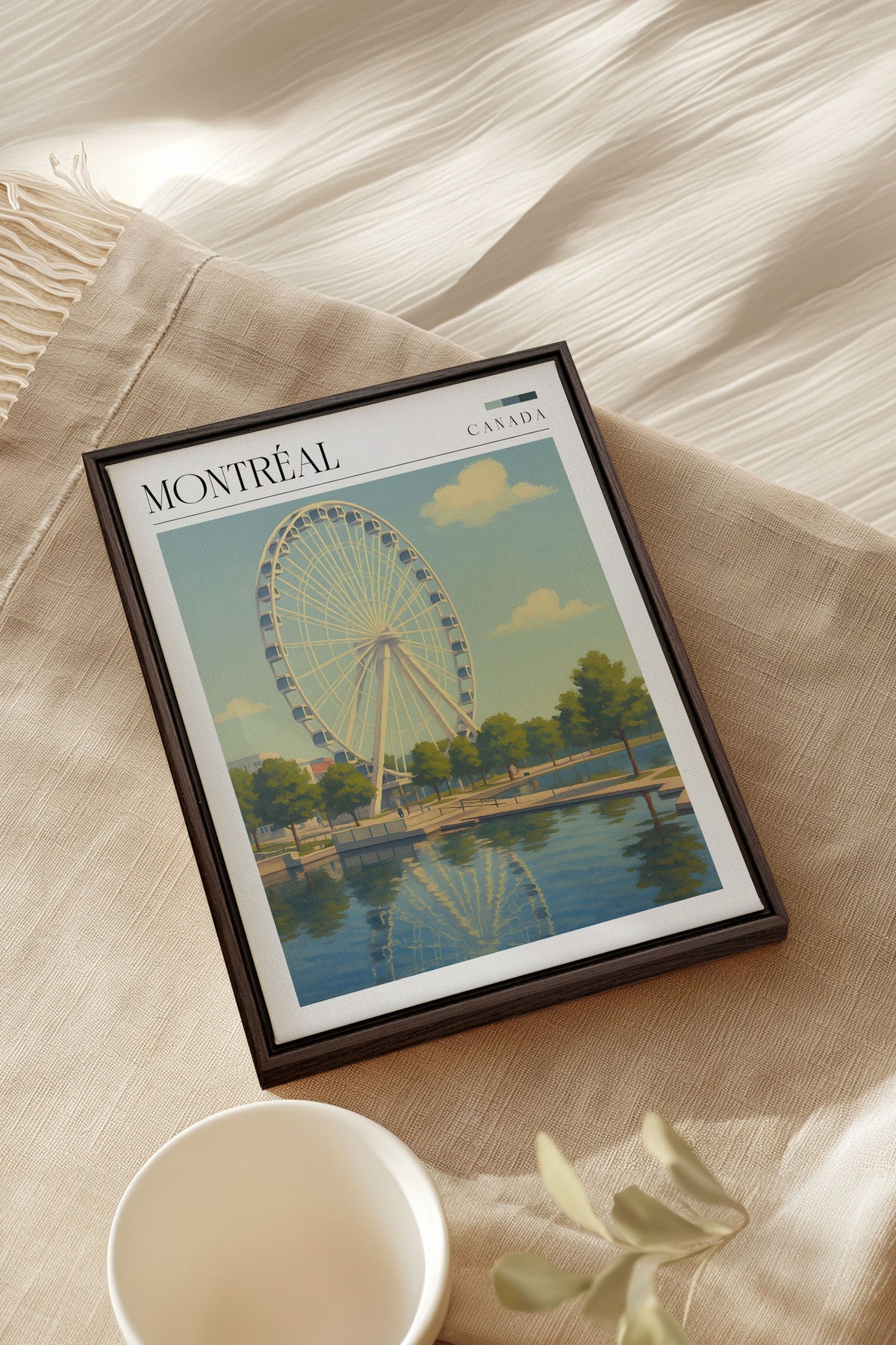 Toile étirée encadrée noire, Montréal avec grande roue, posée sur tissu beige