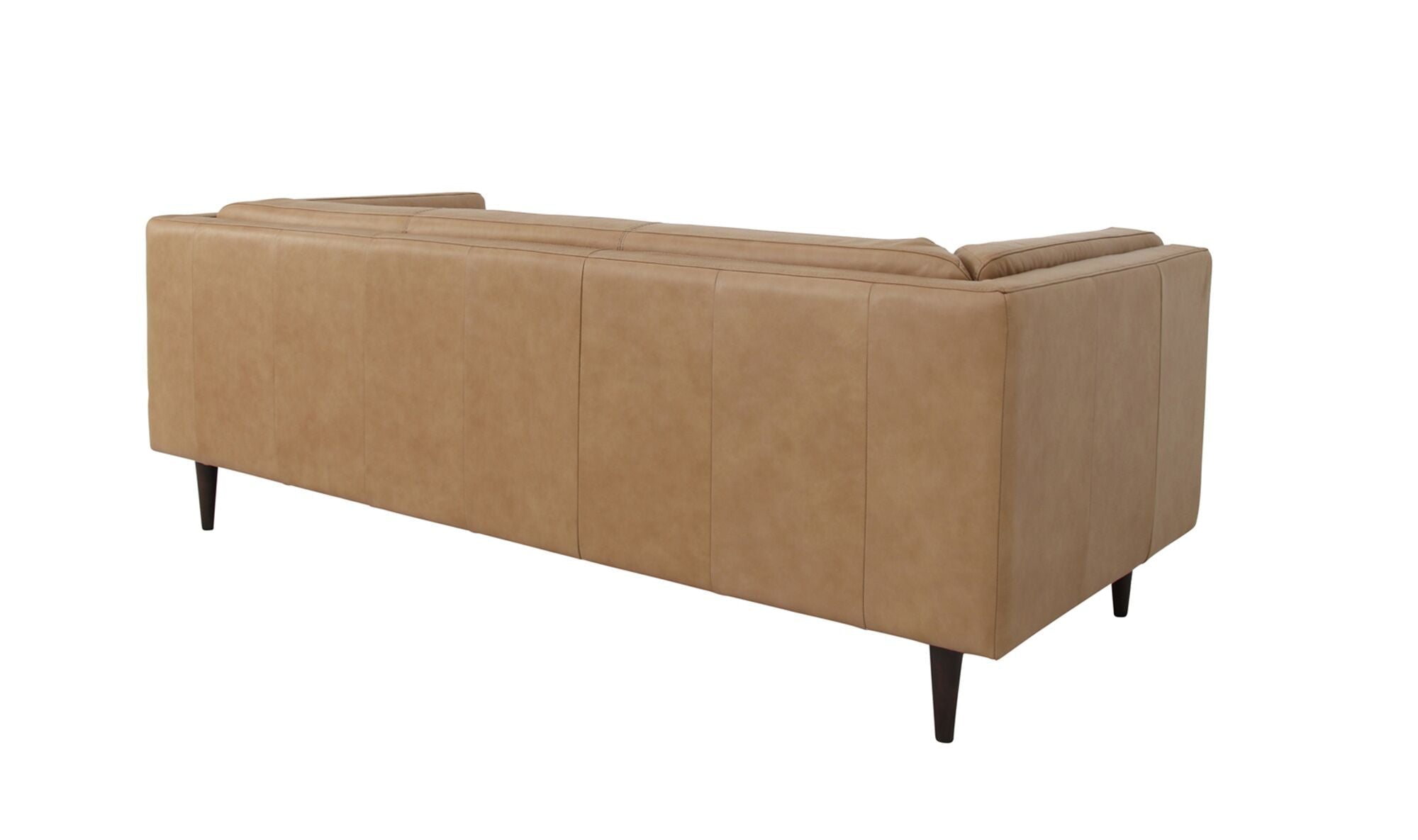 Canapé en cuir beige, vue trois-quarts arrière, flancs rembourrés, pieds fins