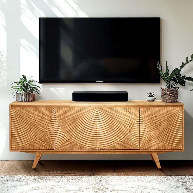 Meuble TV en bois clair à motif cercles, 2 portes et pieds inclinés.