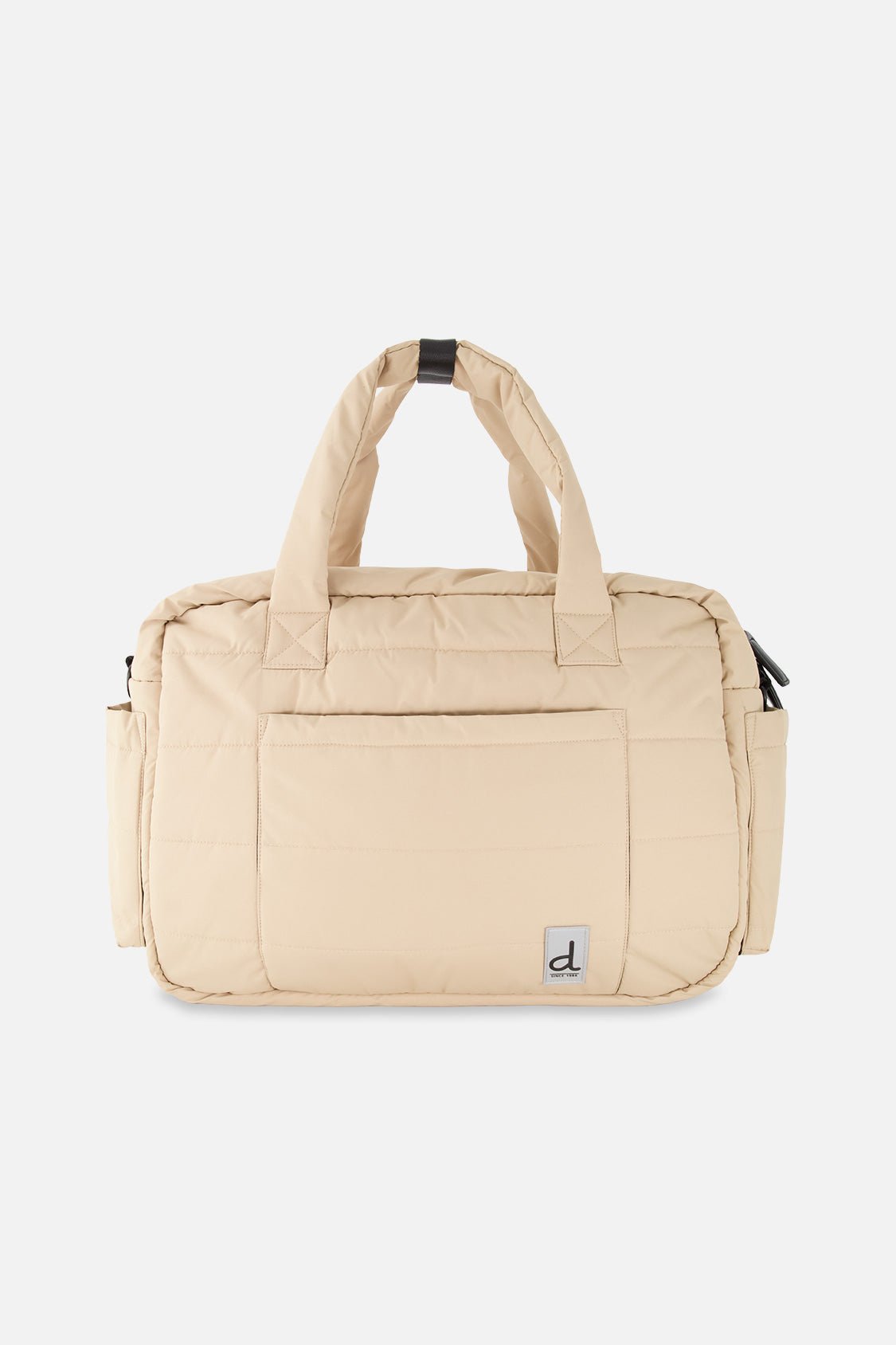 Sac à couches beige avec matelas à langer inclus, compartiments de rangement et attaches pour poussette de la marque Deux par Deux.